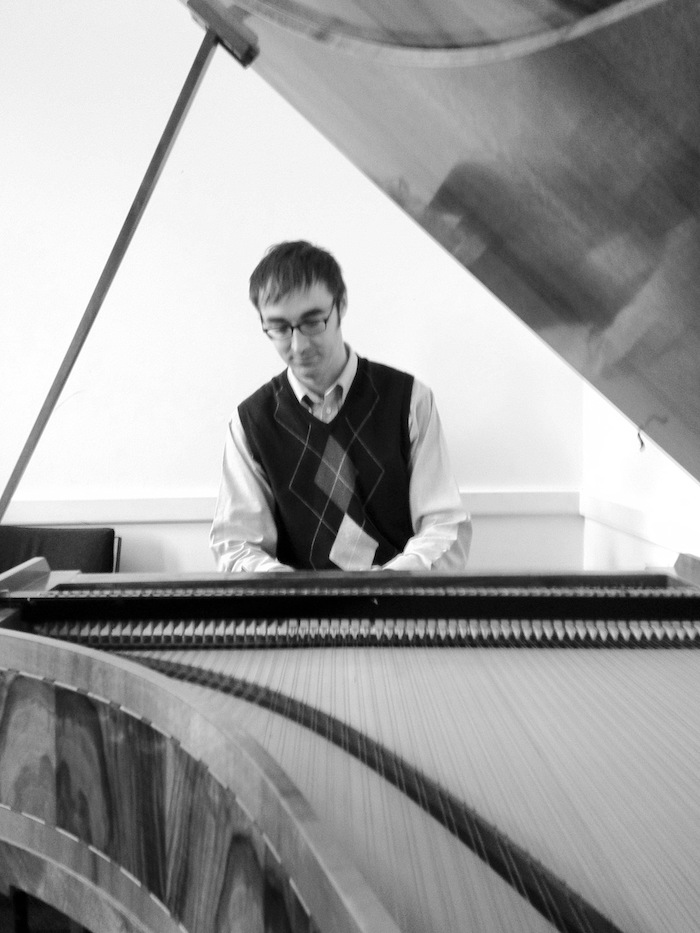 Thomas playing performing on a fortepiano at the Royal College of Music in London.